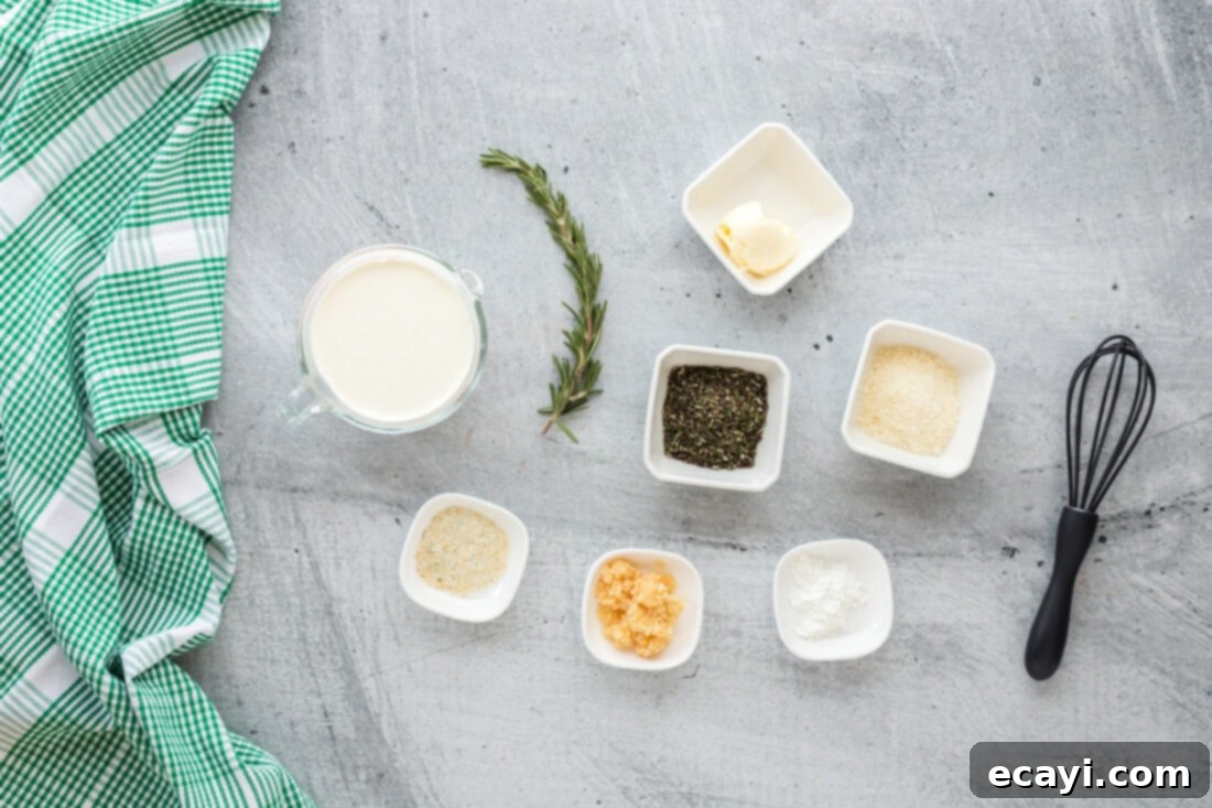 Aromatic Rosemary Cream Sauce 4 Arrangement of fresh ingredients for Rosemary Cream Sauce, including butter, garlic, rosemary, and cream.