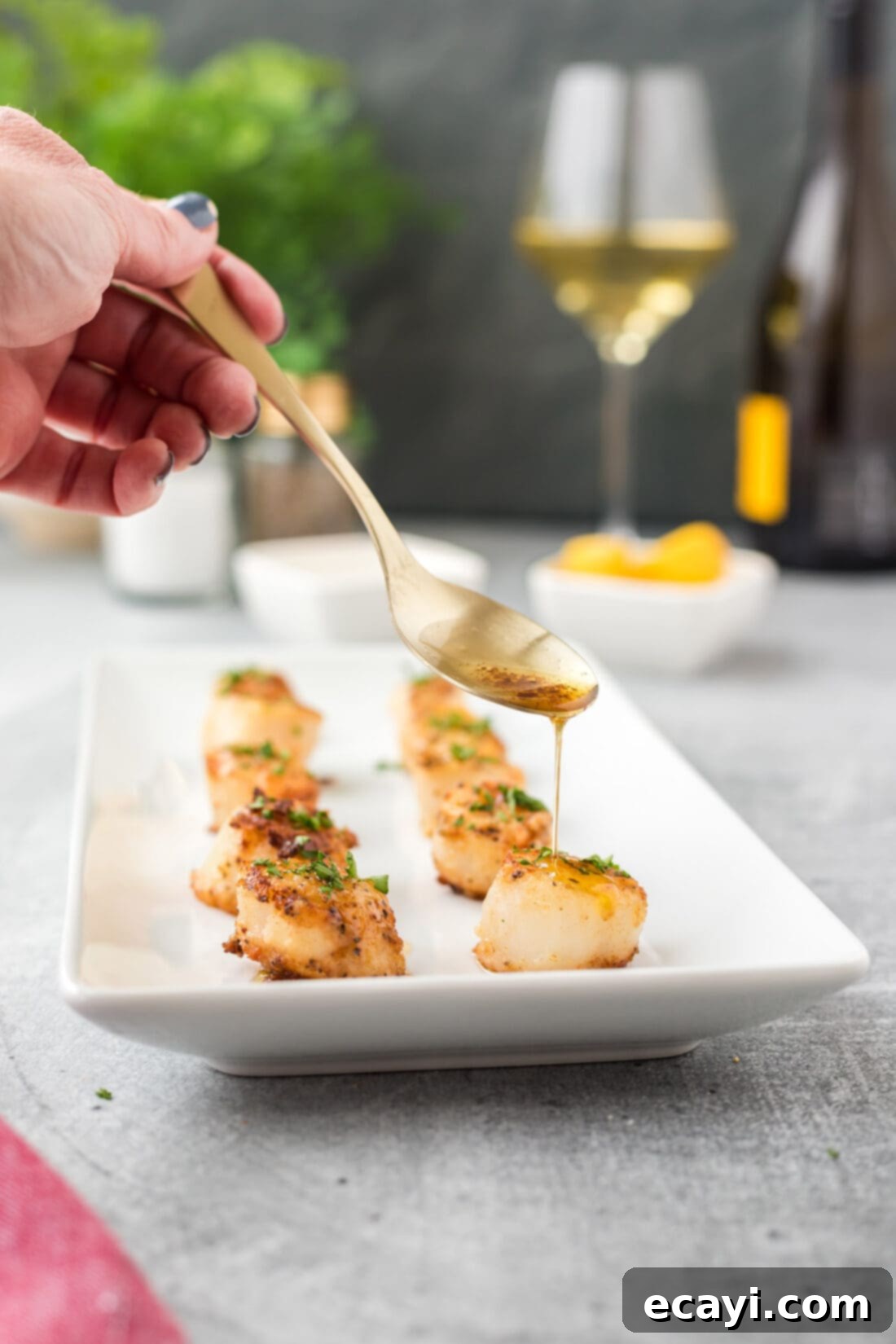Succulent Pan Seared Scallops 2 drizzling butter on Pan Seared Scallops