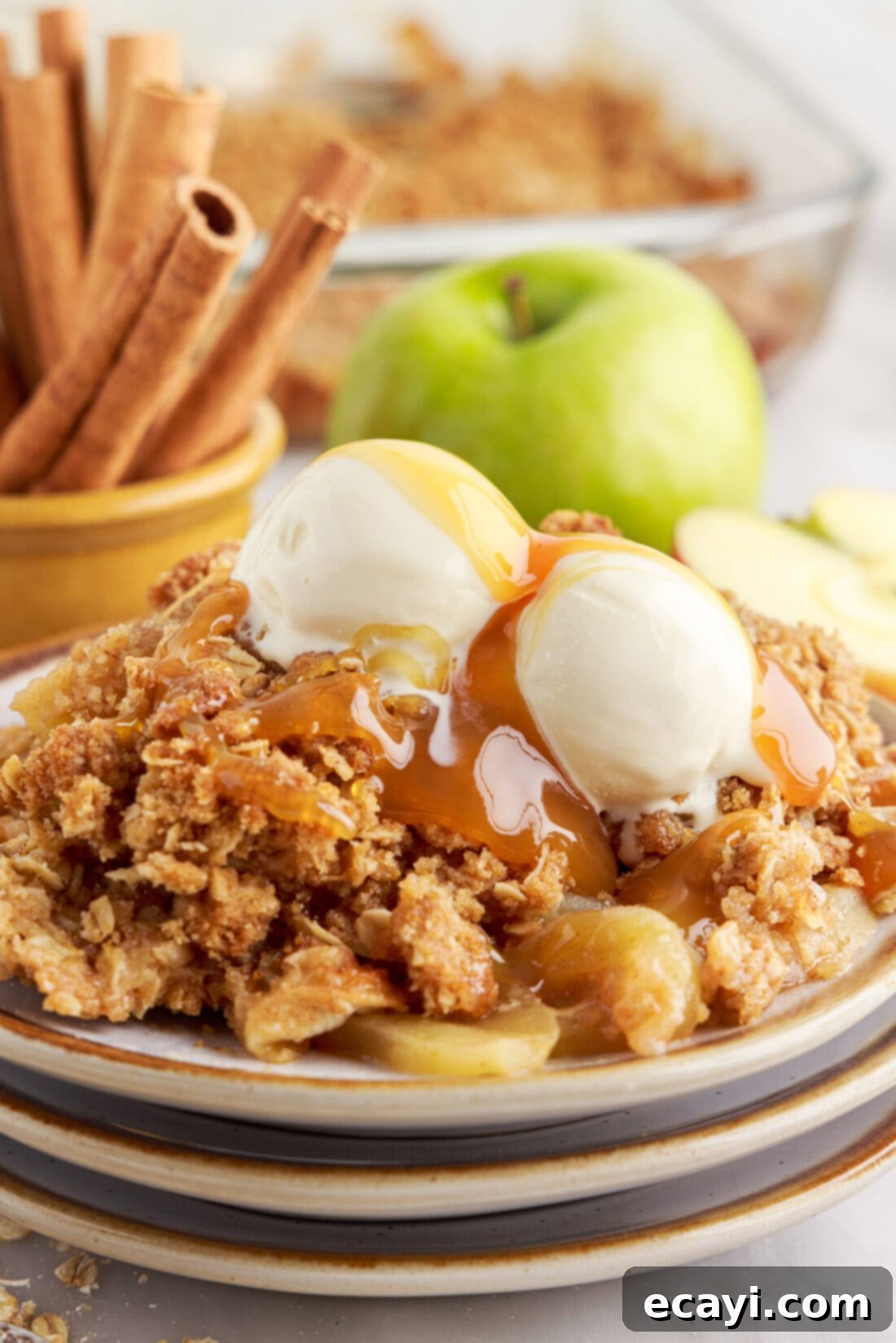 Warm Apple Crumble Delight 2 Warm apple crumble with a scoop of vanilla ice cream on top