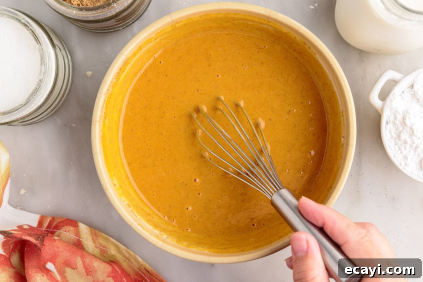 Pumpkin Pie Bites 13 pumpkin pie filling in a bowl with a whisk