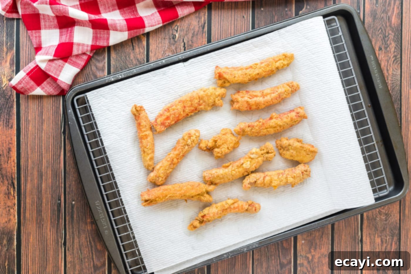 Golden Crispy Crab Legs 12 fried crab legs on a paper towel