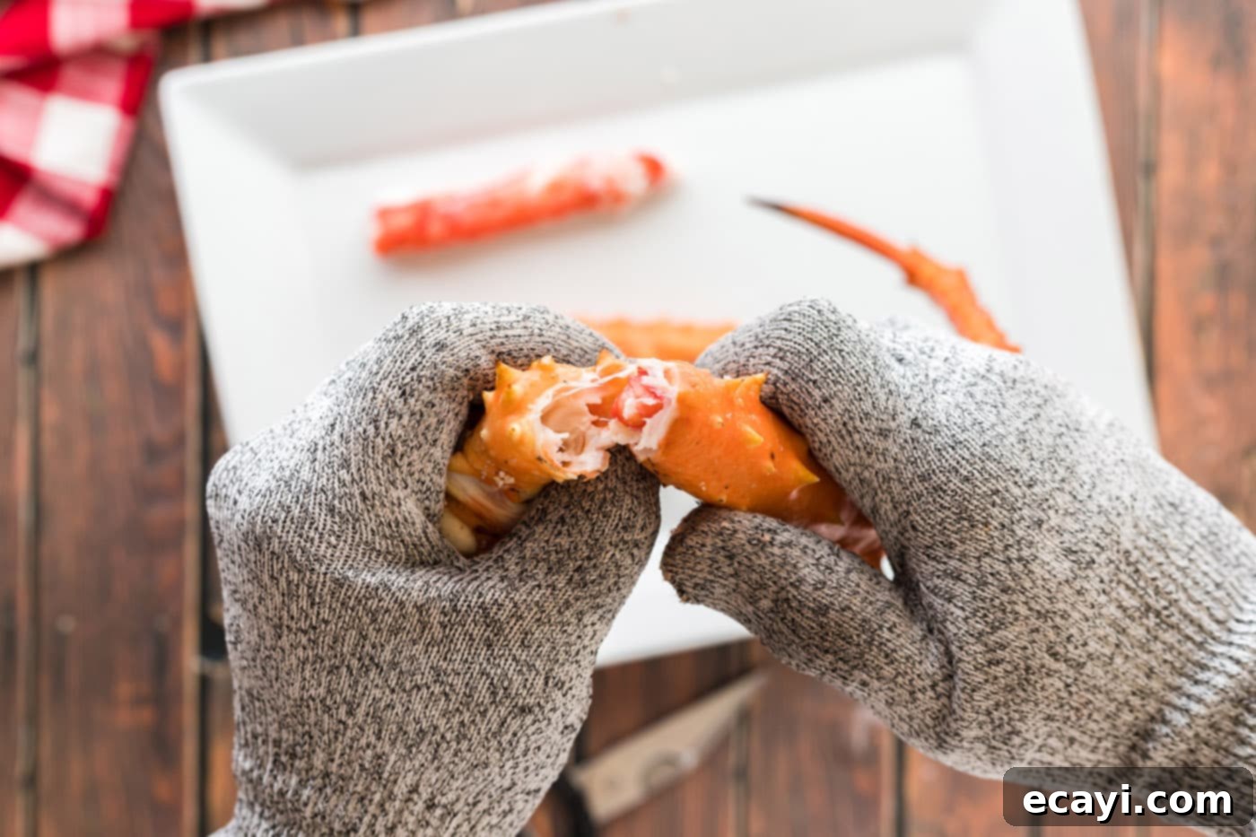 Golden Crispy Crab Legs 5 hands cracking crab leg open
