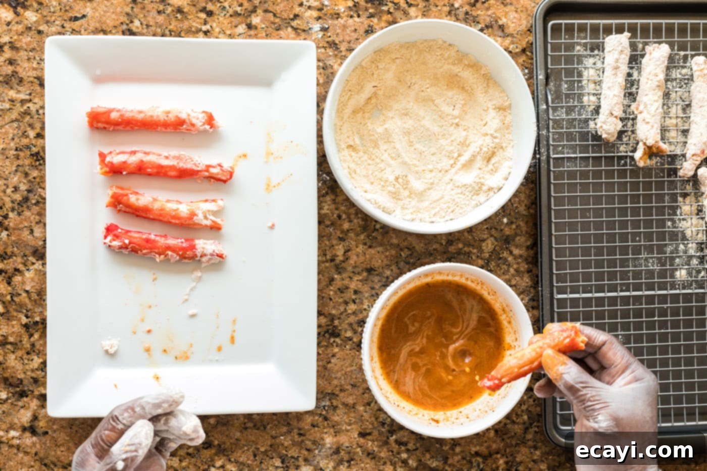Golden Crispy Crab Legs 9 dipping crab leg into seasoned egg mixture