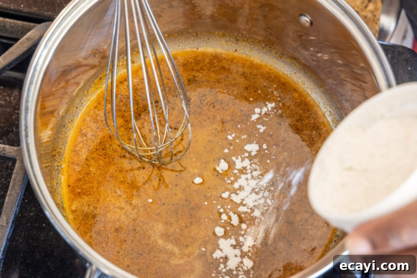 Decadent Lobster Mac and Cheese 6 adding flour to roux with a whisk