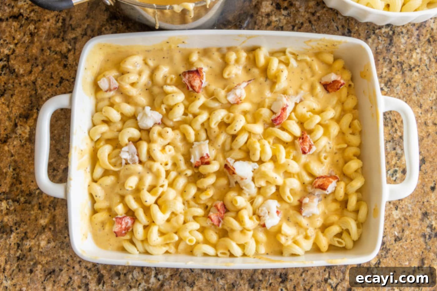 Decadent Lobster Mac and Cheese 10 lobster mac and cheese in a baking dish