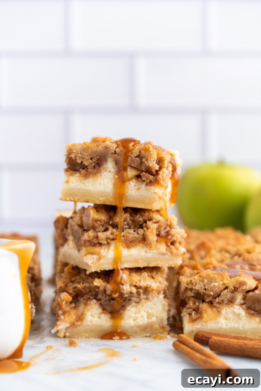Harvest Caramel Apple Cheesecake Squares 2 Layers of delicious Caramel Apple Cheesecake Bars with shortbread crust, cheesecake, apples, and streusel