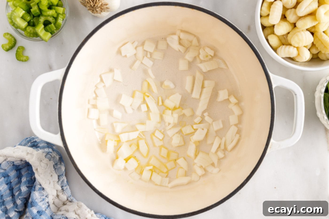 Creamy Gnocchi Chicken Bliss 5 sauteeing onion in a pot