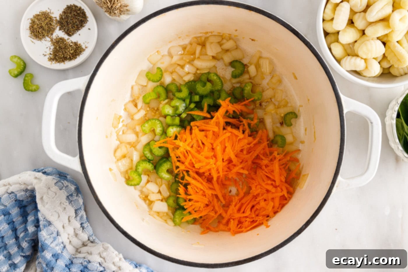 Creamy Gnocchi Chicken Bliss 7 shredded carrots, celery, onion, and garlic in a stockpot