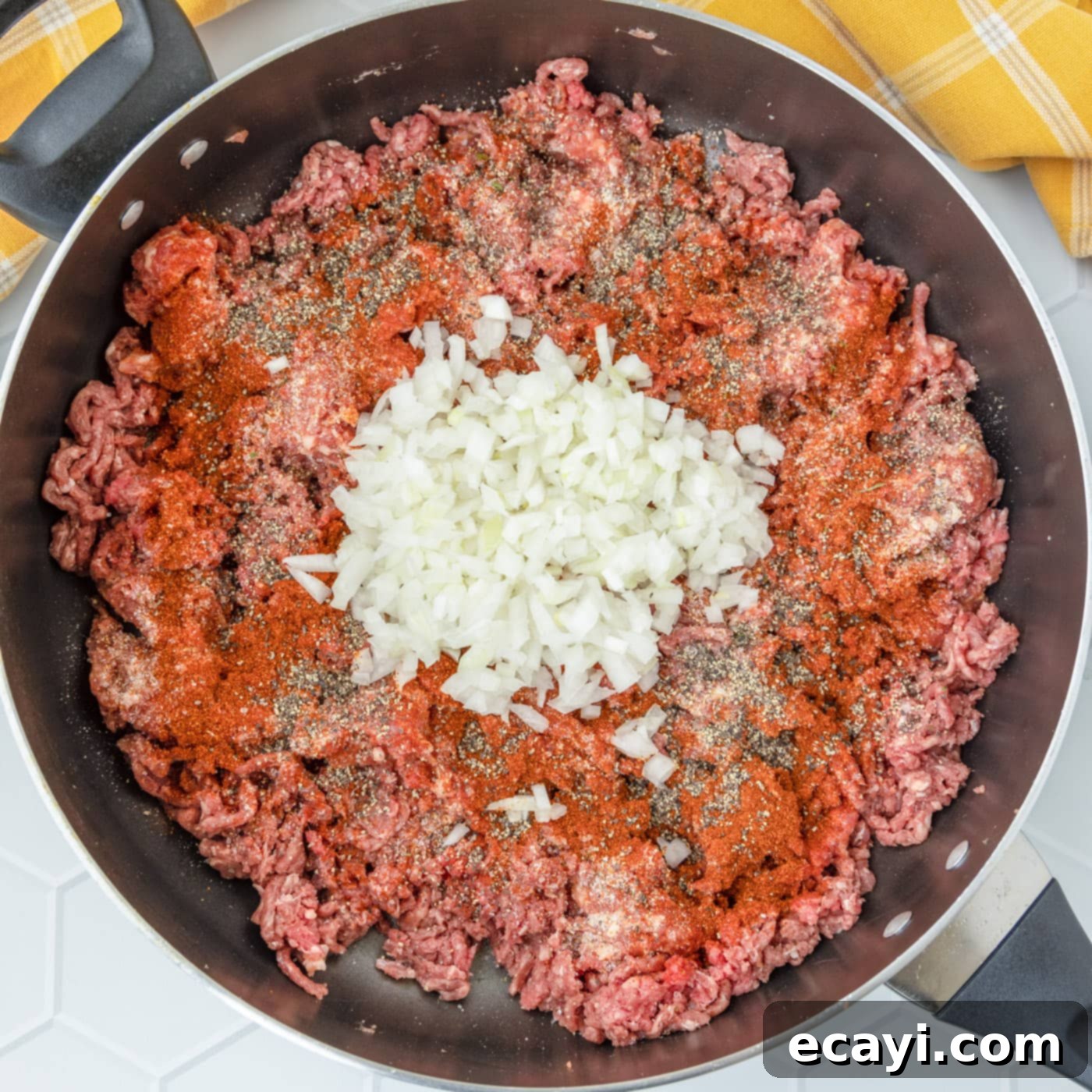 Hearty Stuffed Bell Pepper Bake 6 Italian sausage, ground beef, onions, and seasoning browning together in a skillet.