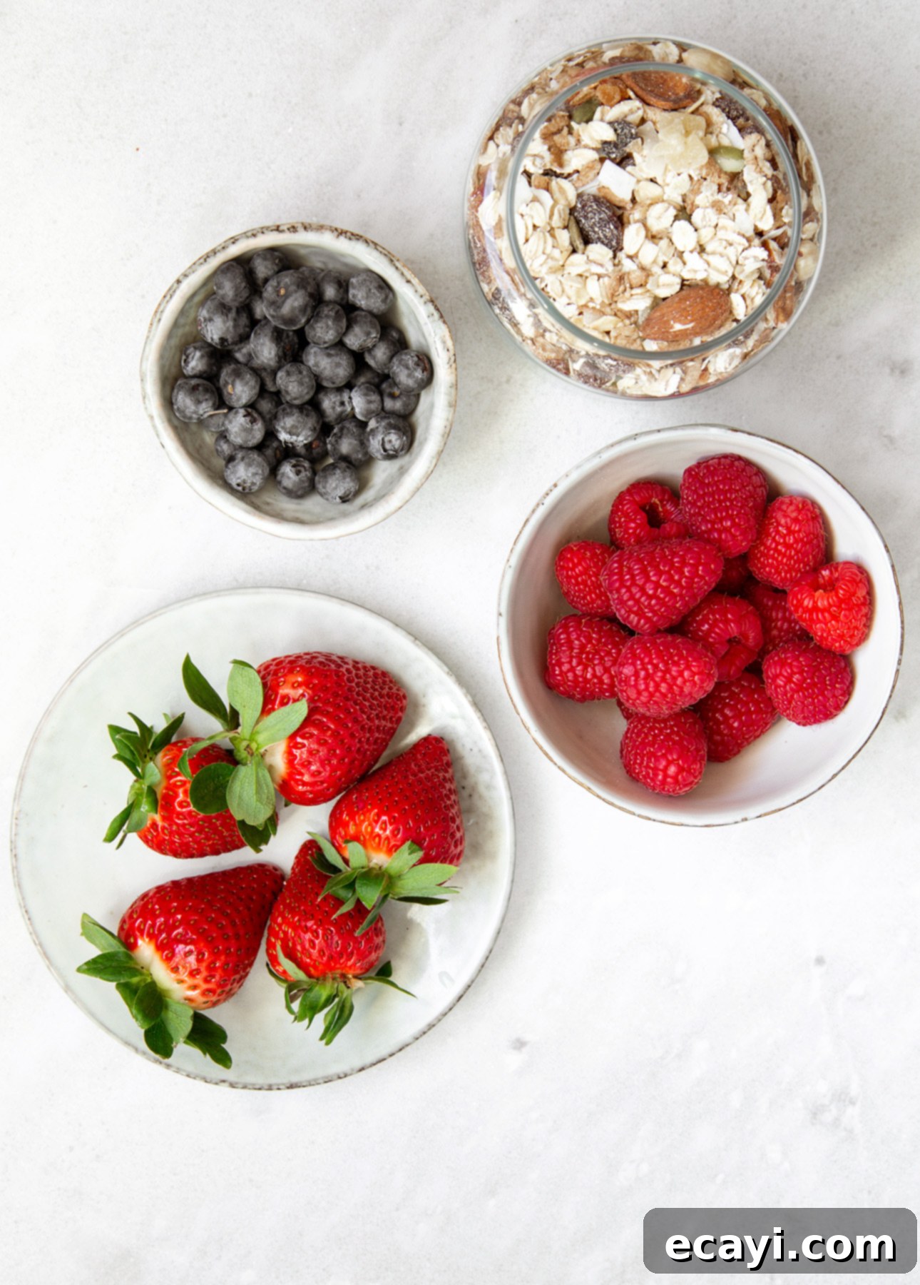 Overnight Maple Berry Delight 6 Bowl of rolled oats with a variety of berries, the ingredients required to make Maple Berry Overnight Oats // FoodNouveau.com