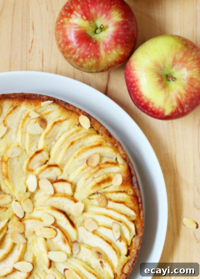 Classic Apple Frangipane Tart 6 Entire Apple Frangipane Tart on a white plate