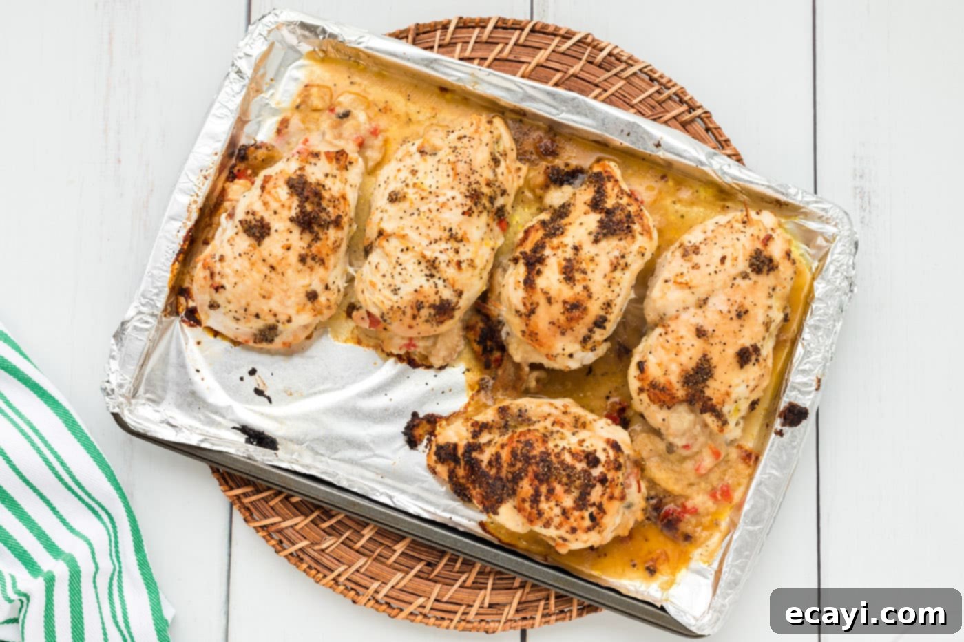 Savory Stuffed Chicken Breasts 12 Baked stuffed chicken breasts on a baking sheet
