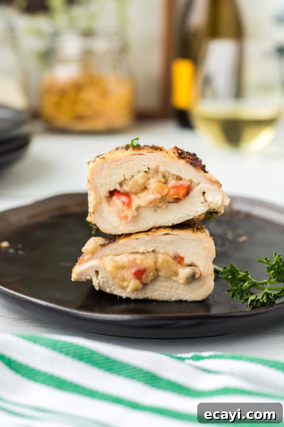 Savory Stuffed Chicken Breasts 13 Stuffed Chicken Breast cut in half on a dinner plate, revealing savory filling