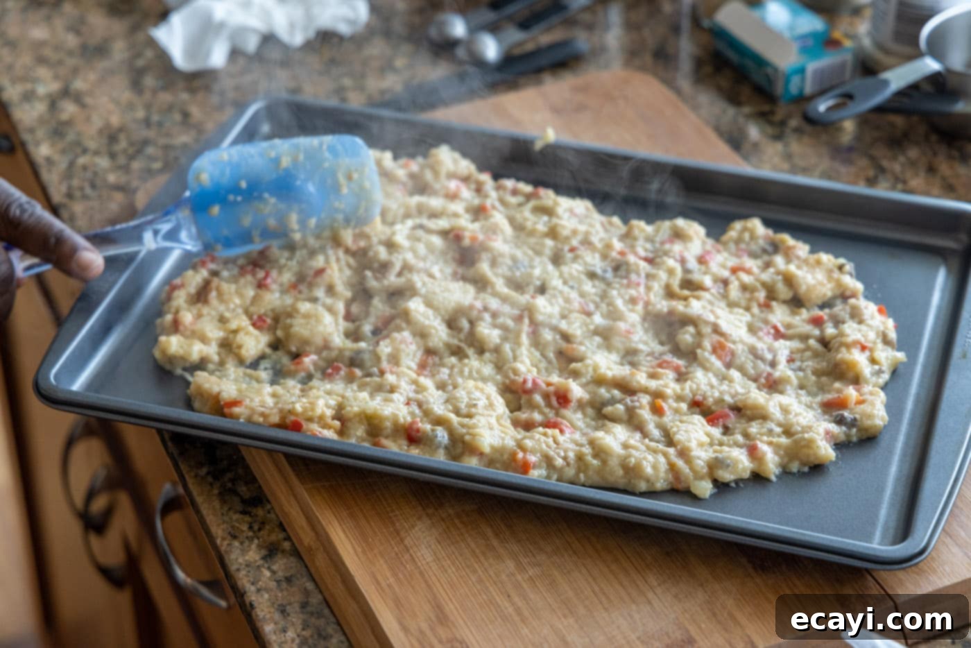 Savory Stuffed Chicken Breasts 7 Spreading stuffed chicken breast filling on a baking sheet to cool