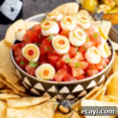 Eye-Popping Halloween Dip 12 Halloween Eyeball Salsa in a bowl