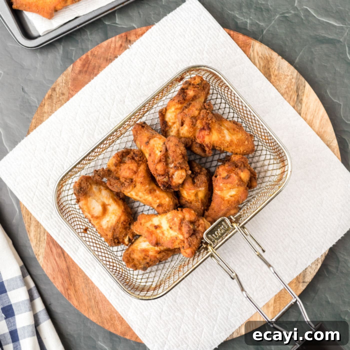 Addictive Korean Crunch 8 fried chicken wings in a deep fryer basket