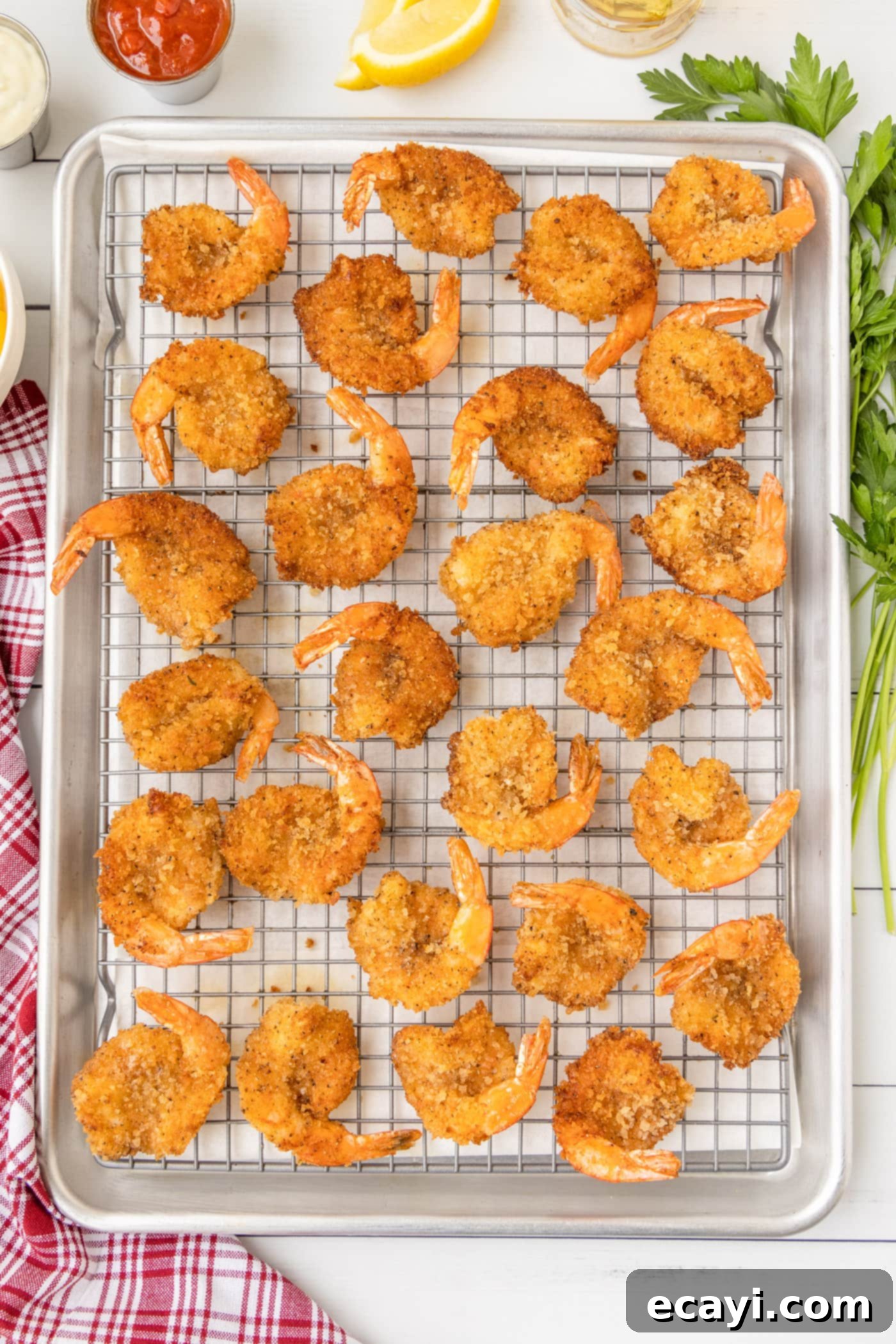 Golden Crispy Fanned Shrimp 11 crispy butterfly shrimp on a pan