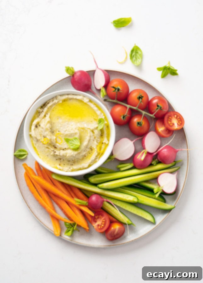 Velvety White Bean Parmesan Dip 2 White Bean and Parmesan Dip served with fresh vegetables and pita bread