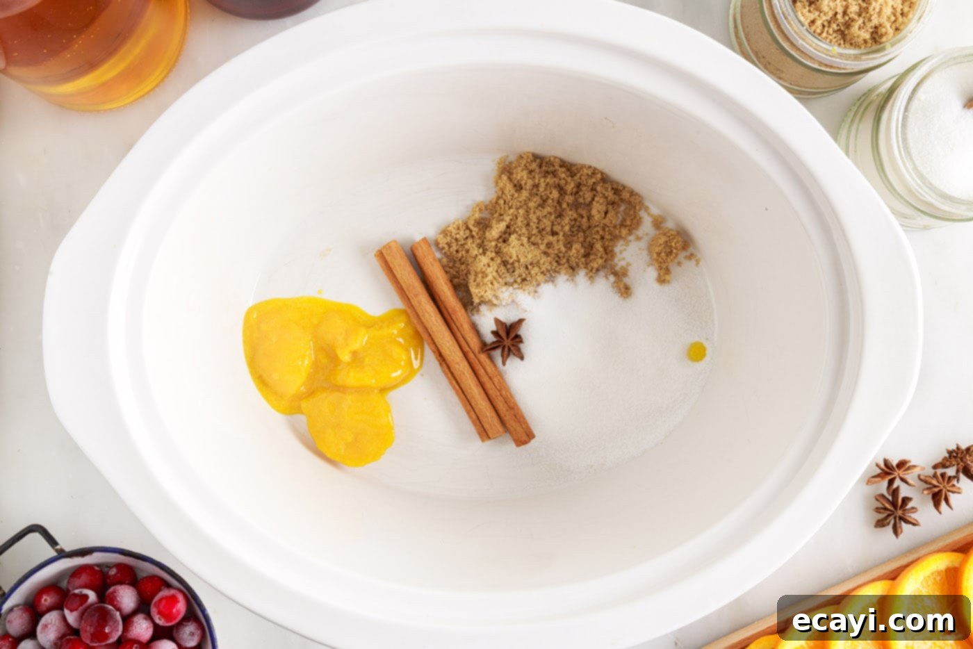 Mulled Cranberry Cheer 5 orange juice concentrate, sugars, cinnamon sticks and star anise in crockpot