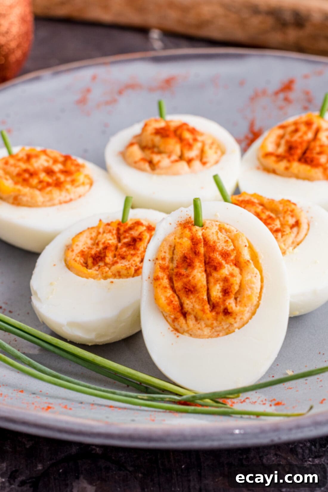 Creamy Pumpkin Deviled Delights 2 Pumpkin Deviled Eggs arranged festively on a plate, ready for serving