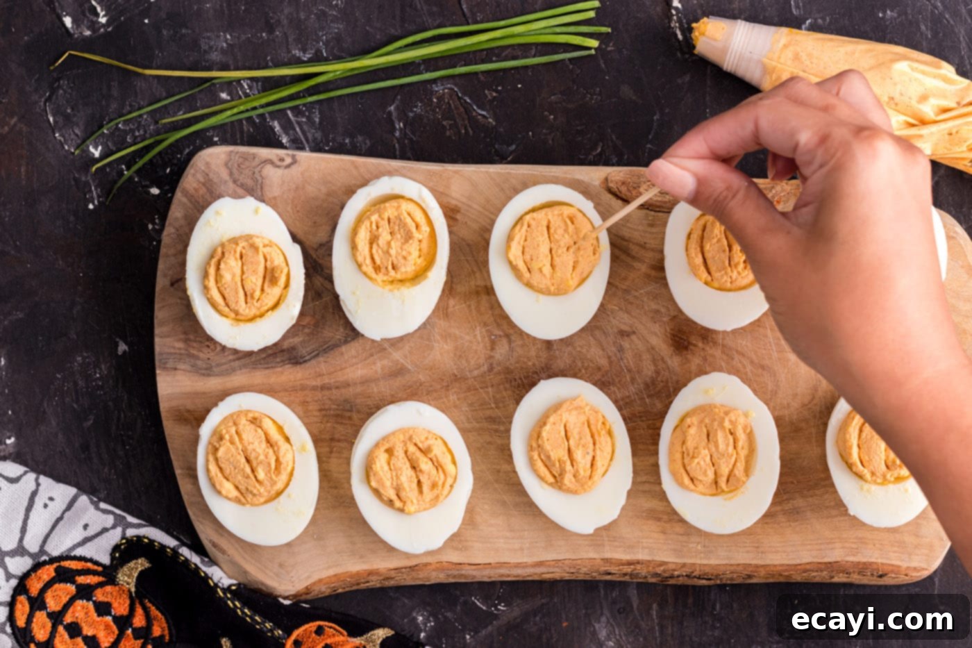 Creamy Pumpkin Deviled Delights 8 adding ridges with a toothpick to deviled eggs for a pumpkin effect
