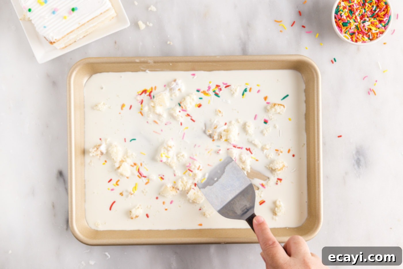 Confetti Cake Swirls 9 Mixing the birthday cake and sprinkles into the ice cream base on the pan.