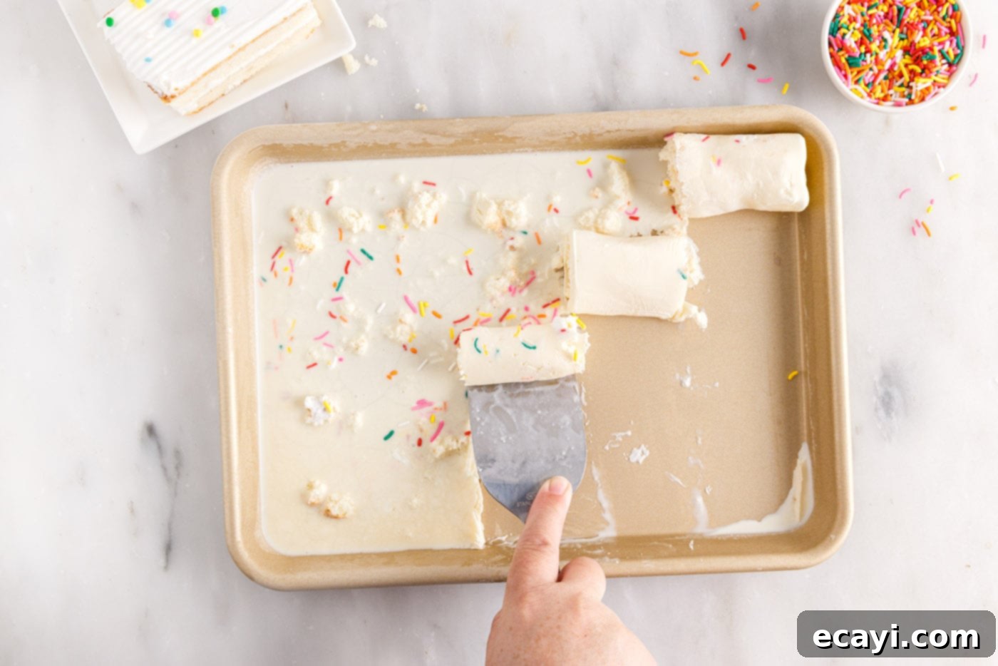 Confetti Cake Swirls 10 Spatula expertly rolling birthday cake ice cream into spirals on the frozen pan.