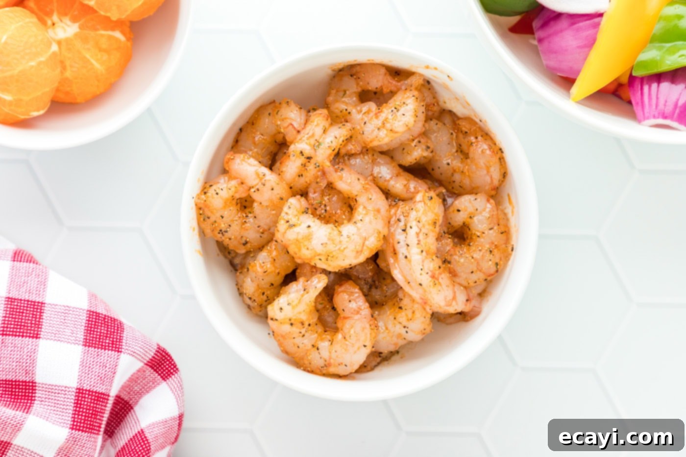 Zesty Peppercorn Shrimp 6 A bowl of medium shrimp, fully coated with the prepared seasoning mix.
