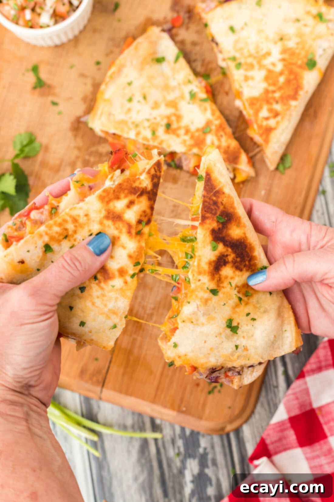 Savory Chicken Quesadilla 3 pulling a cheesy Chicken Quesadilla apart