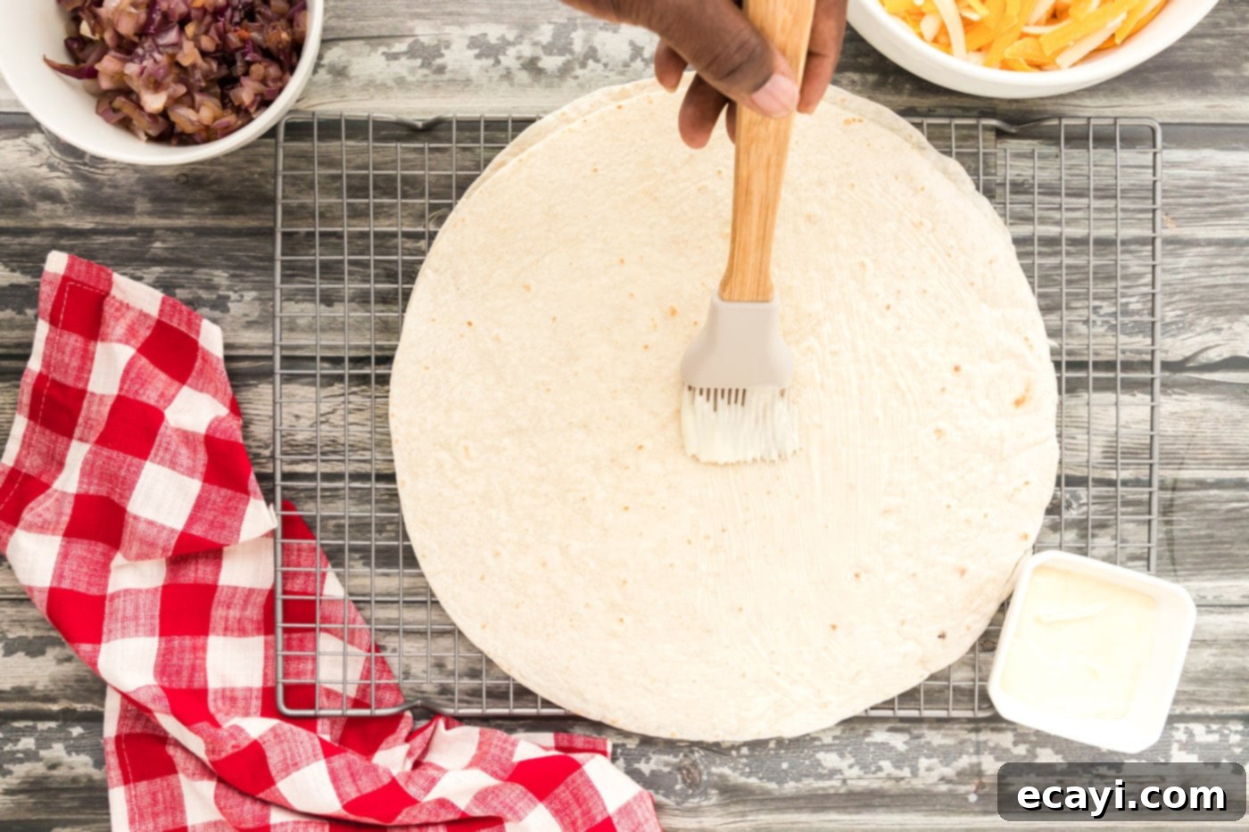 Savory Chicken Quesadilla 9 buttering a tortilla
