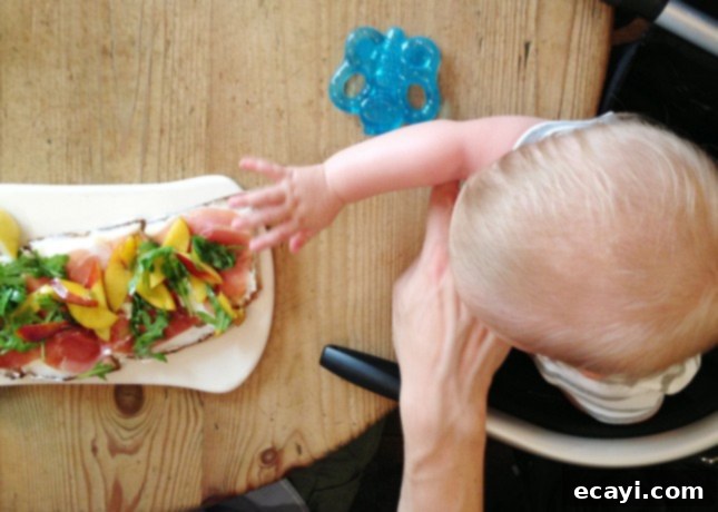 Paris Through Tiny Eyes: Exploring the City with Your Baby 5 Comfortably installed in a portable high chair at Le Pain Quotidien, in Paris