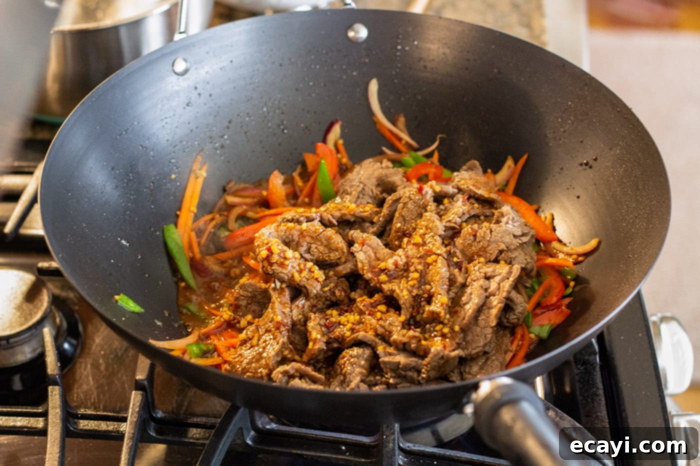 Ultimate Beef Lo Mein 11 beef lo mein with sauce in a wok