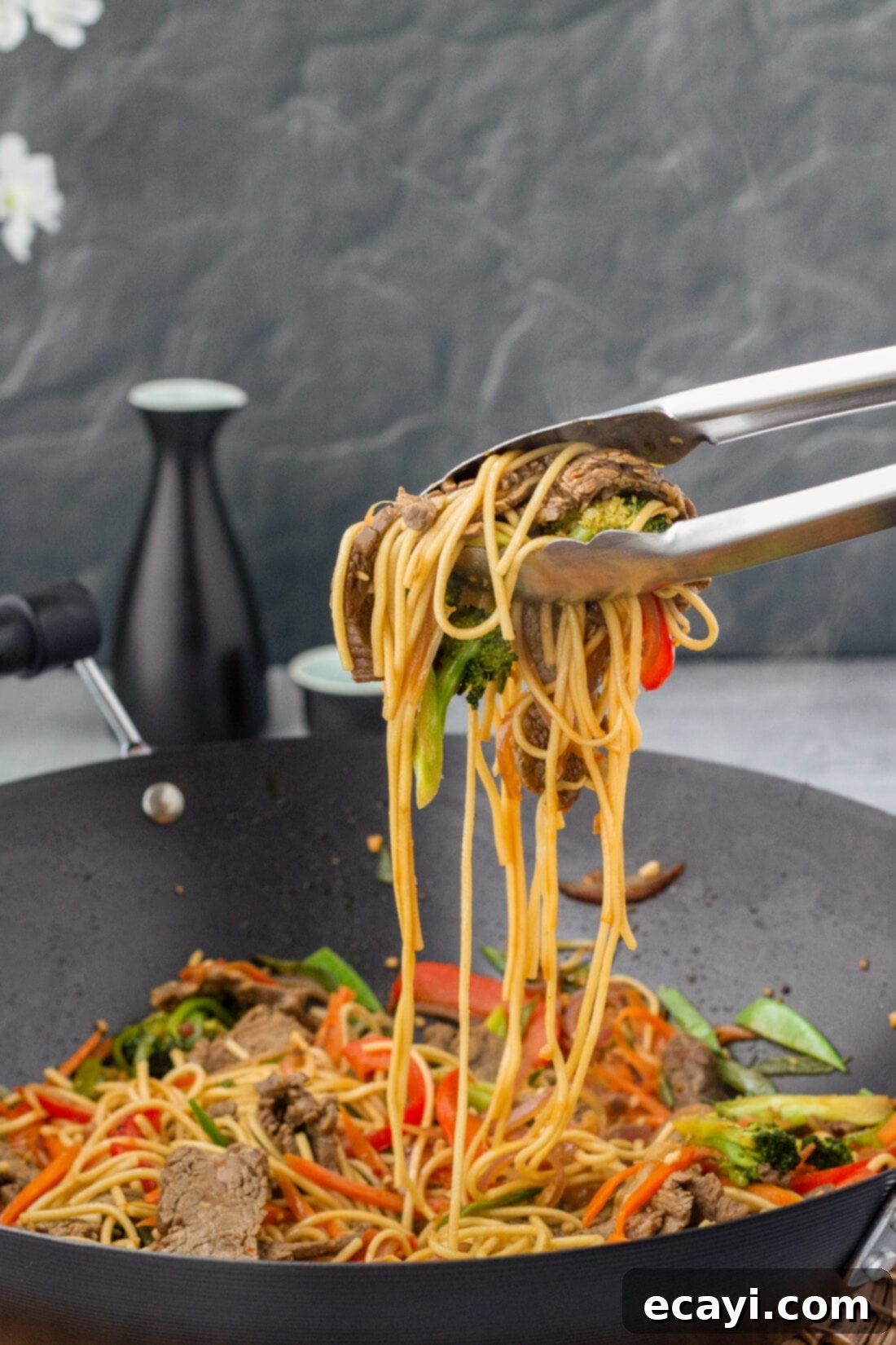 Ultimate Beef Lo Mein 3 tongs lifting Beef Lo Mein