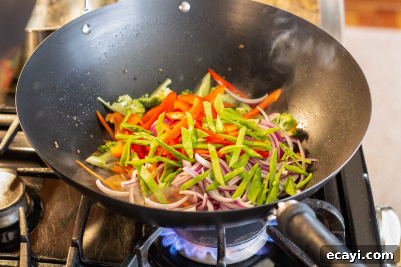 Ultimate Beef Lo Mein 8 stir fry veggies in a wok