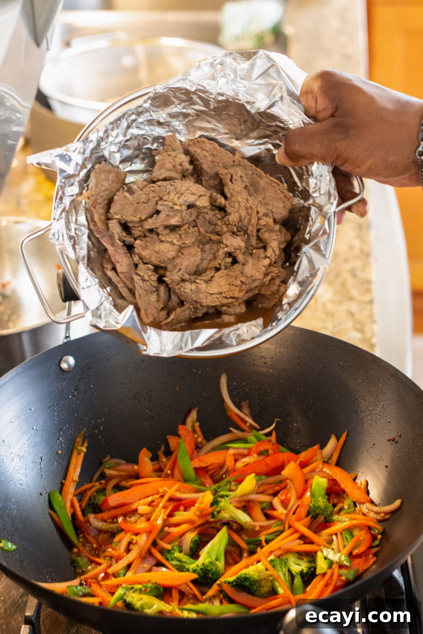 Ultimate Beef Lo Mein 10 adding beef to wok with veggies