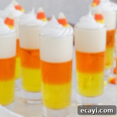 Harvest Hues Shooters 12 Candy Corn Jello Shots garnished with whip cream
