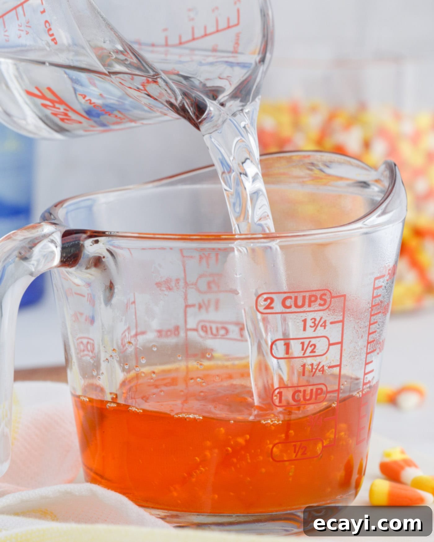 Harvest Hues Shooters 7 pouring water into orange jello mix
