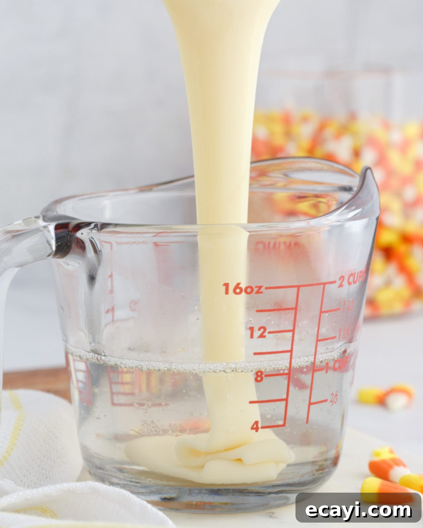Harvest Hues Shooters 9 pouring sweetened condensed milk into unflavored gelatin
