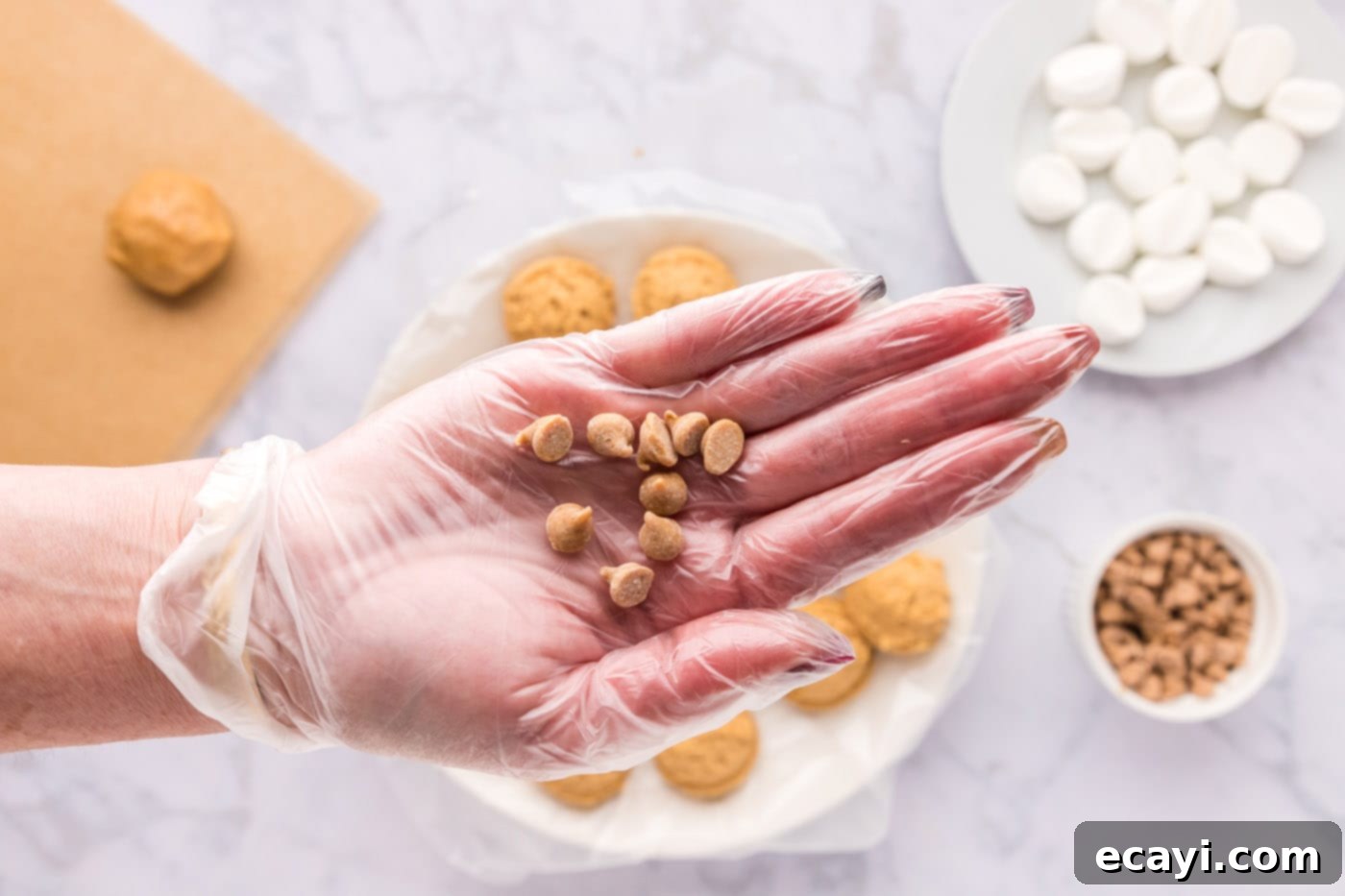 Sweet & Salty Fluffernutter Delights 17 hand holding peanut butter chips