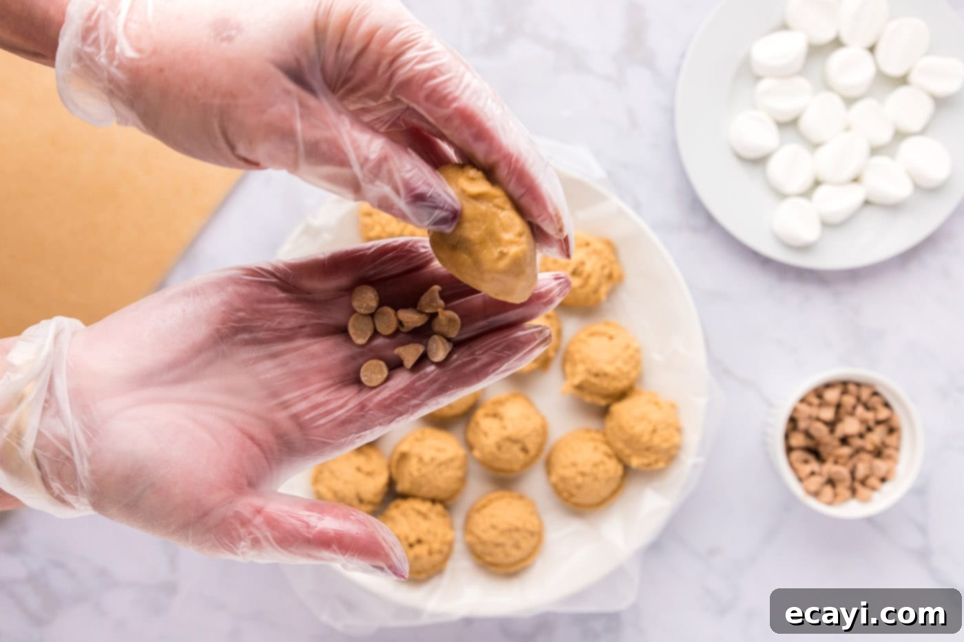 Sweet & Salty Fluffernutter Delights 19 pressing peanut butter cookie ball into peanut butter chips for topping