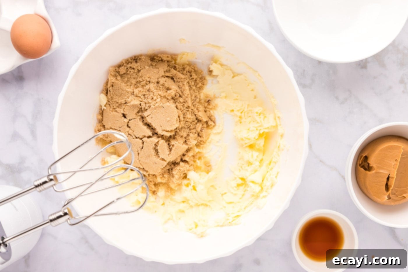 Sweet & Salty Fluffernutter Delights 6 using a mixer to incorporate brown sugar with softened butter for cookies