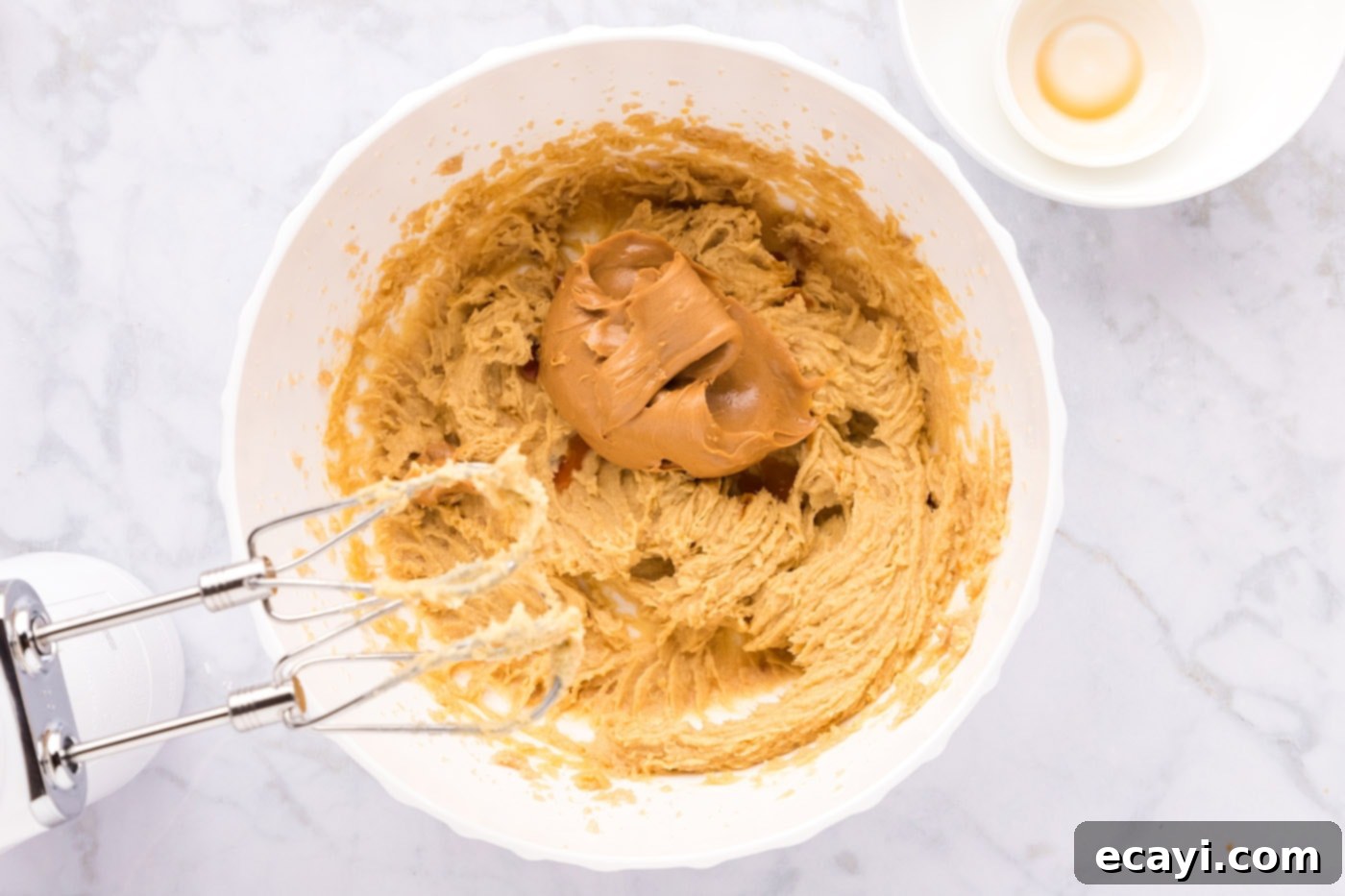 Sweet & Salty Fluffernutter Delights 9 adding creamy peanut butter to the cookie dough mixture
