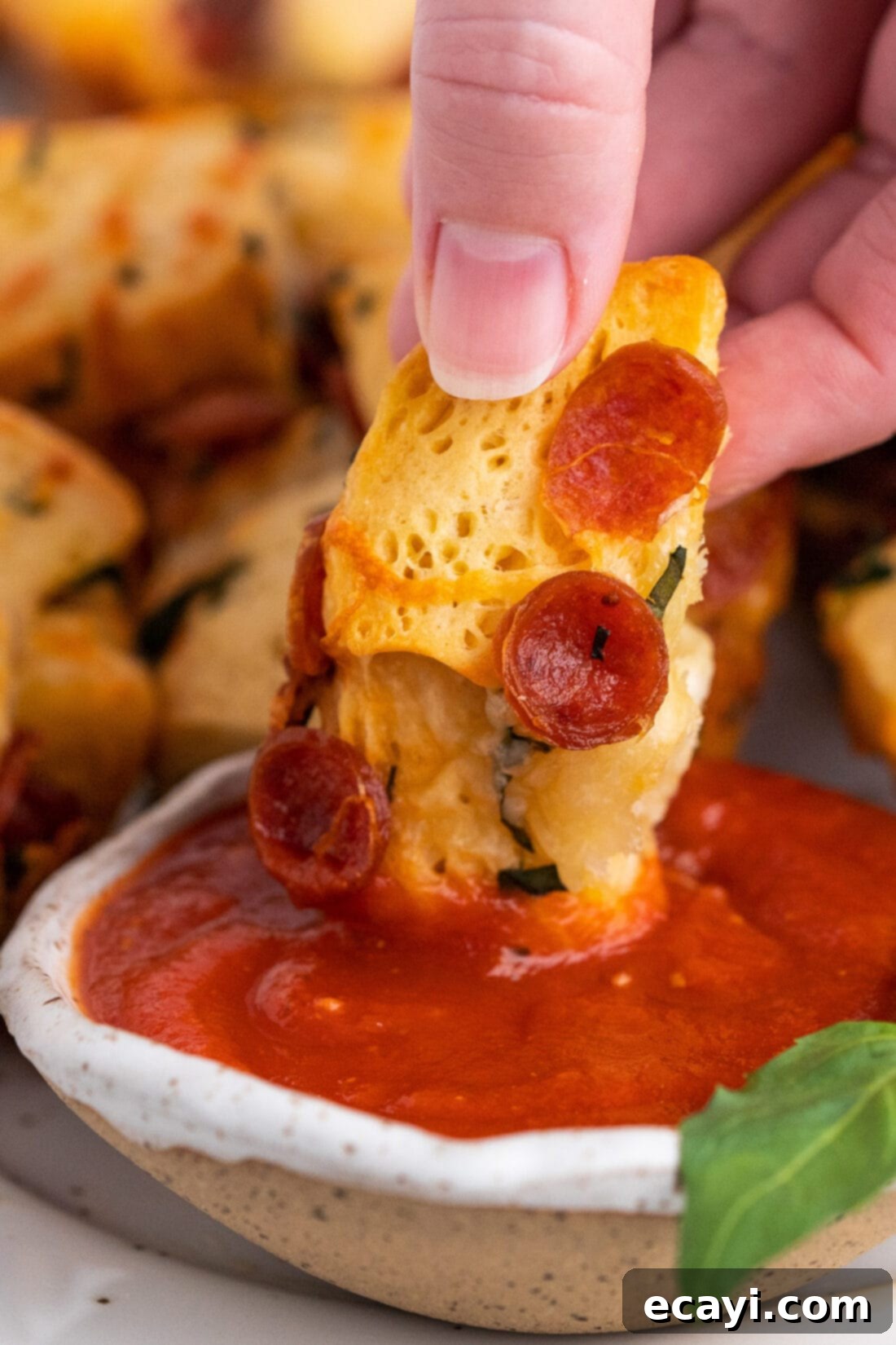 Pizza Bites 12 dipping a pizza bite