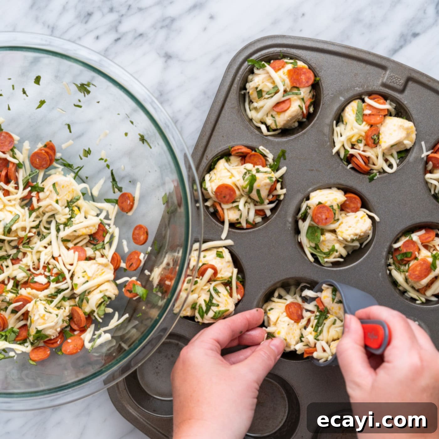 Pizza Bites 10 adding pizza bite ingredients to a muffin pan