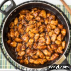 Crispy General Tso Chicken 10 General Tso Chicken simmering in a skillet with sauce