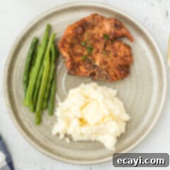 Golden Crispy Pork Chops 12 Plate of crispy pan-fried pork chops ready to eat