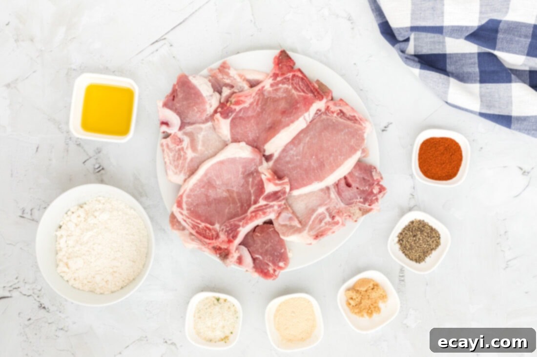 Golden Crispy Pork Chops 4 Selection of fresh ingredients for frying pork chops, including spices, oil, and pork