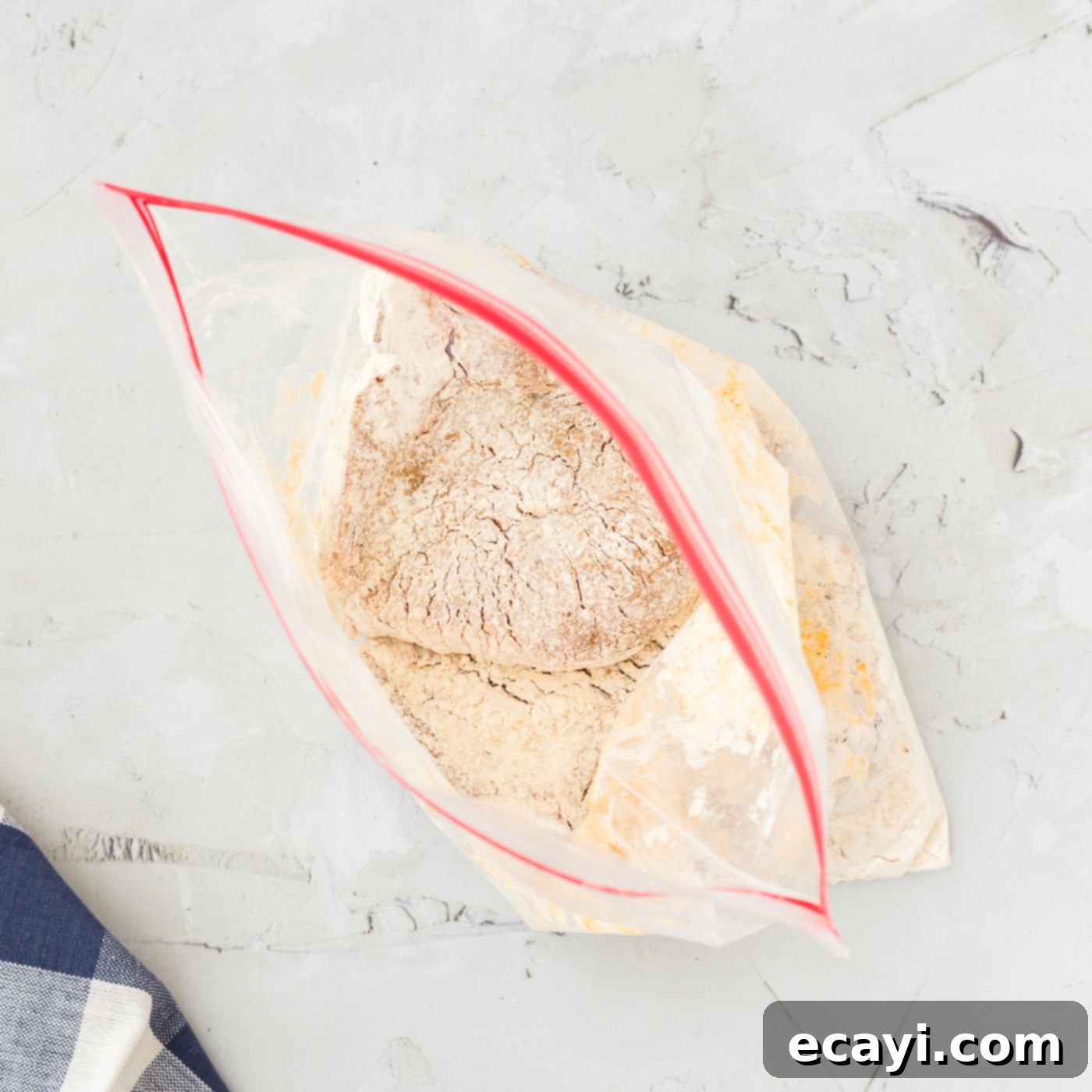 Golden Crispy Pork Chops 7 A gallon-sized ziplock bag filled with all-purpose flour, ready for coating pork chops