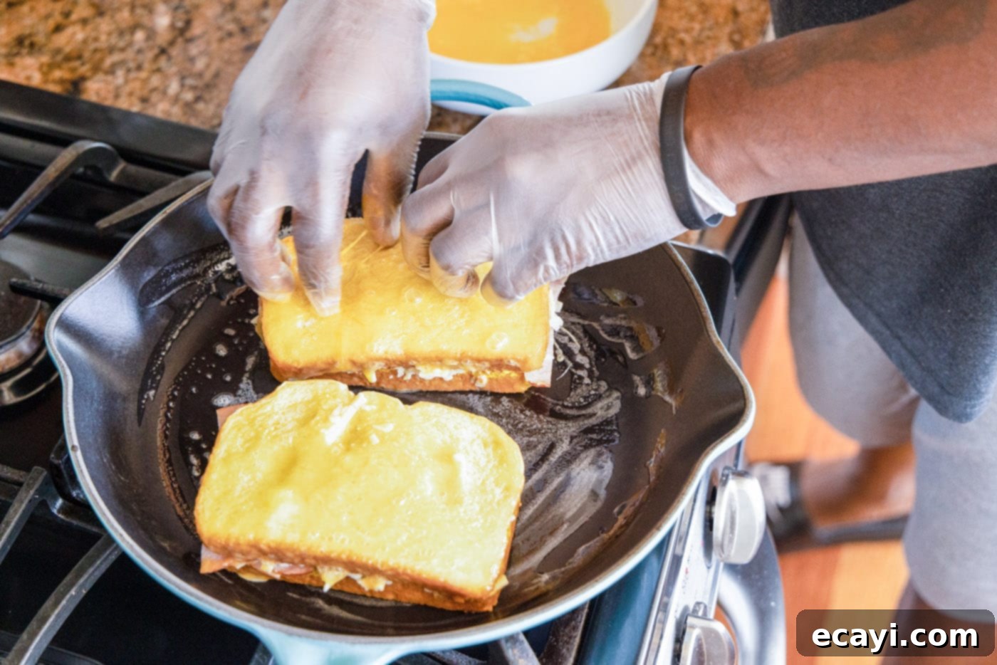 Sweet and Savory Monte Cristo Indulgence 11 frying monte cristo sandwich in skillet with butter