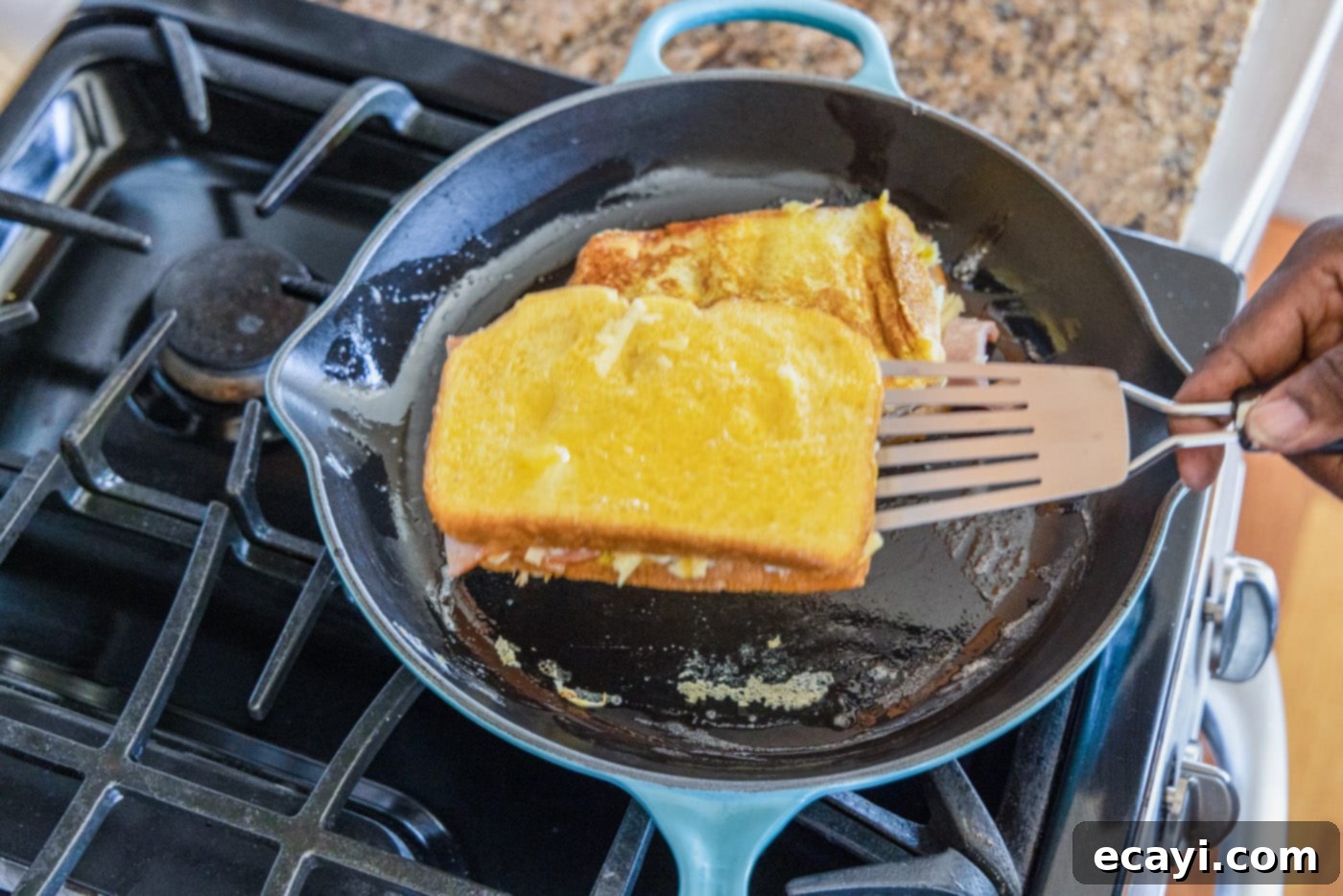 Sweet and Savory Monte Cristo Indulgence 12 spatula flipping monte cristo sandwich
